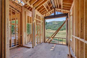 Miscellaneous room with lofted ceiling, healthy amount of natural light, and a skylight