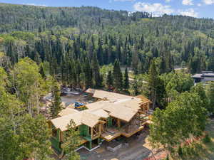 View from above of property with a forest