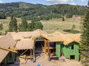 View from above of property with a forest