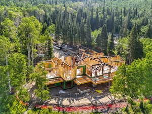 View of subject property featuring a heavily wooded area