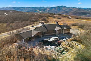 Aerial overview of property's location featuring a mountain backdrop