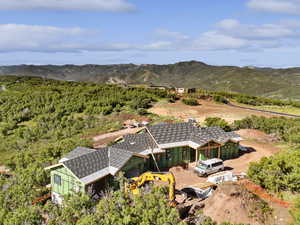 View of subject property with mountains