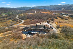 Aerial overview of property's location featuring a mountain backdrop