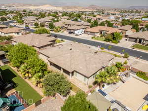 Aerial perspective of suburban area featuring a mountain backdrop