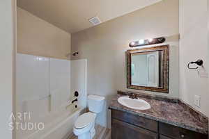 Full bathroom with vanity and washtub / shower combination