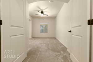 Spare room with carpet flooring, ceiling fan, a textured ceiling, and a smoke detector