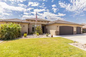 Mediterranean / spanish-style house featuring an attached garage, concrete driveway, a front yard, stucco siding, and stone siding