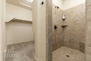 Bathroom featuring tiled shower