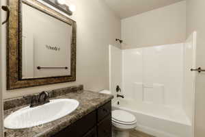 Bathroom with vanity and shower / bath combination