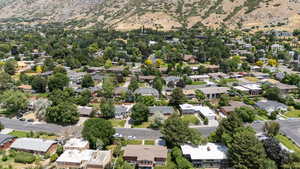 Aerial view of residential area featuring a mountain backdrop