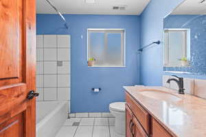 Full bath featuring vanity, tile patterned floors, and bathing tub / shower combination