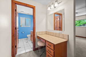 Bathroom with vanity and tile patterned flooring