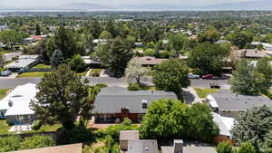 Aerial perspective of suburban area with a mountain backdrop