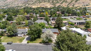 Aerial view of residential area featuring a mountain backdrop