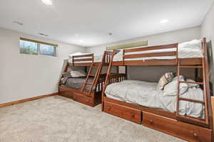 Carpeted bedroom featuring baseboards and recessed lighting