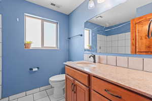 Full bath featuring a shower, tile patterned floors, and vanity