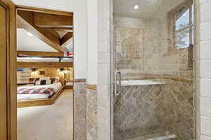 Full bathroom with a stall shower and recessed lighting