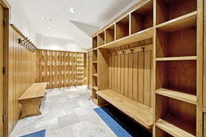 Mudroom with stone tile floors and recessed lighting