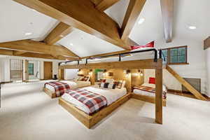 Bedroom featuring carpet floors, recessed lighting, and wood walls
