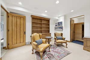 Sitting room featuring light carpet and recessed lighting