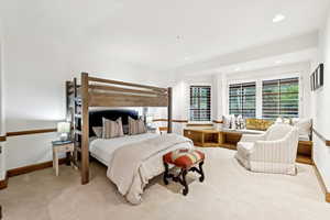 Carpeted bedroom with baseboards and recessed lighting
