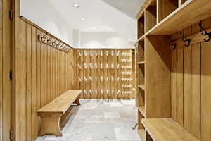 Mudroom featuring stone finish floors and recessed lighting