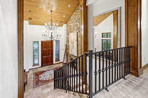 Foyer entrance featuring wooden ceiling, a chandelier, recessed lighting, and high vaulted ceiling