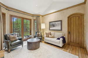 Living area featuring hardwood / wood-style floors and lofted ceiling
