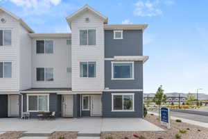 Multi unit property featuring a mountain view and a patio
