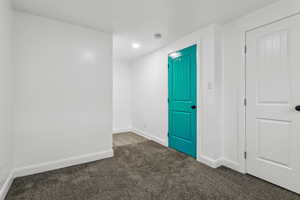 Spare room featuring carpet flooring and recessed lighting