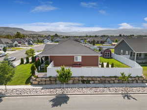 Aerial perspective of suburban area featuring a mountainous background