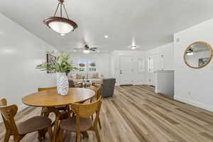 Dining space featuring ceiling fan, light wood-style floors, a textured ceiling, and recessed lighting