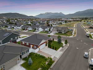 Aerial perspective of suburban area with a mountain backdrop
