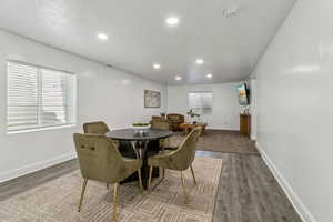 Dining space featuring recessed lighting and wood finished floors