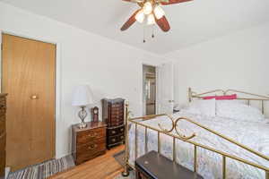 Bedroom with light wood-style flooring and ceiling fan