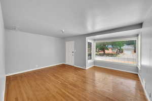 Unfurnished room featuring wood finished floors