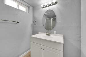 Bathroom with vanity and a shower