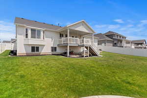 Rear view of property featuring stairs, a fenced backyard, stucco siding, and a wooden deck