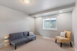 Sitting room with carpet and recessed lighting