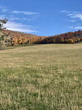 View of mountain background featuring rural landscape