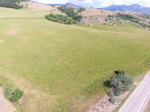 Aerial view of sparsely populated area with a mountain backdrop