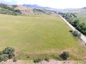 Overview of rural landscape featuring a mountain backdrop