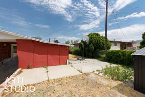 View of yard with an outbuilding
