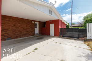 View of building exterior featuring a carport