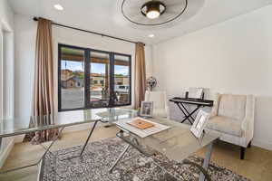 Home office with wood finished floors and recessed lighting