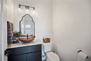 Half bath with toilet and vanity