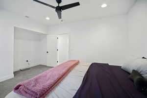 Carpeted bedroom with recessed lighting and ceiling fan