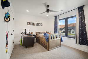 Carpeted bedroom featuring recessed lighting and ceiling fan