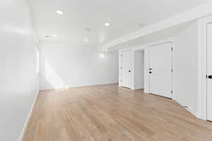 Spare room with light wood finished floors, recessed lighting, and a smoke detector