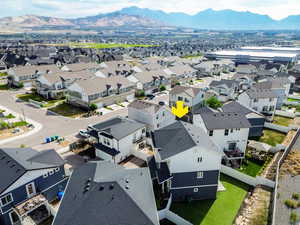 Aerial perspective of suburban area with a mountain backdrop